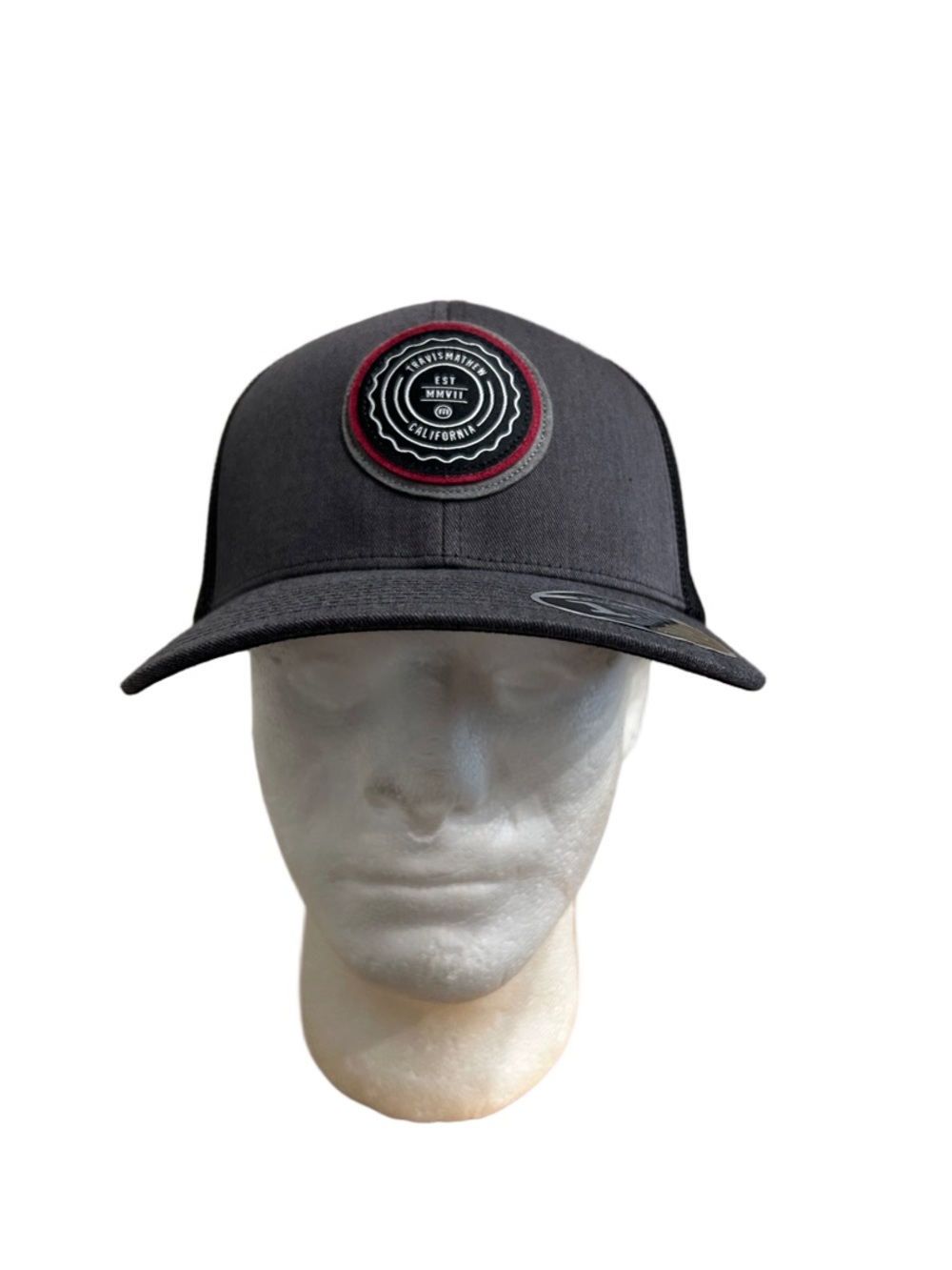 Travis Mathew Black Patch Logo Baseball Cap with Red Accent